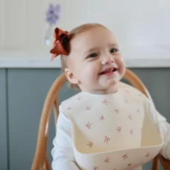 Bavoir à poche en silicone Bows