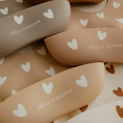 Bavoir en silicone Coeurs Crème