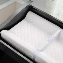 Matelas à langer à rebords